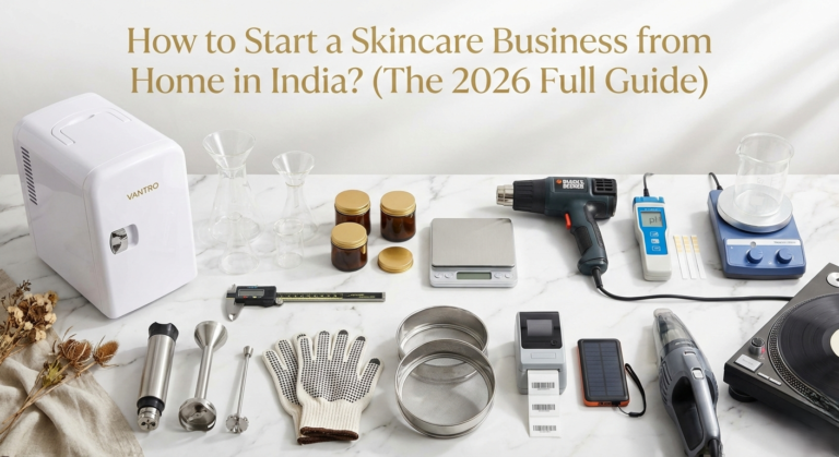 Premium flat lay photograph of essential skincare formulation tools, including a Vantro cosmetic mini-fridge, precision digital scales, borosilicate beakers, amber glass jars, and lab equipment arranged on a white marble surface. The text overlay reads: "How to Start a Skincare Business from Home in India? (The 2026 Full Guide)".